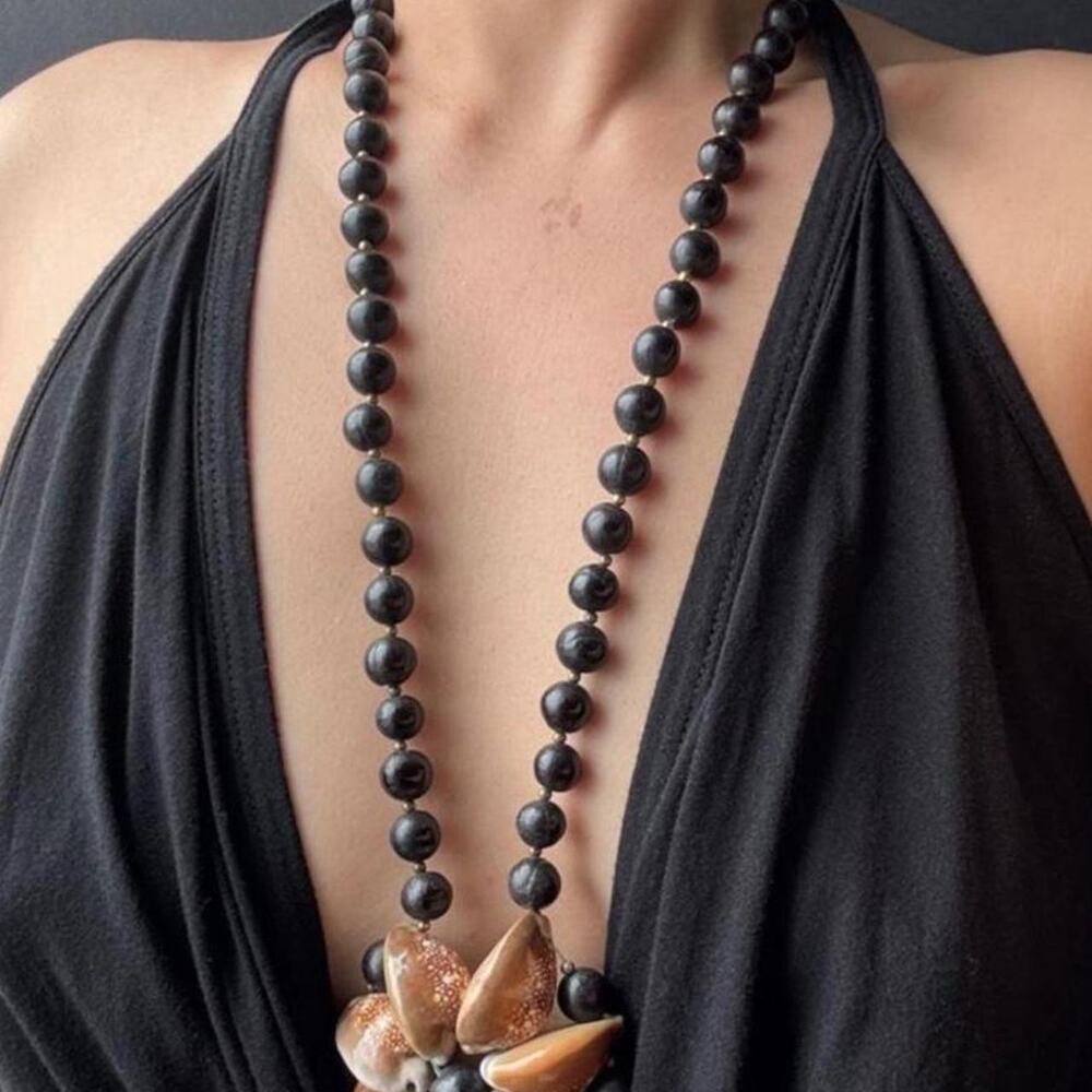 Black beaded necklace with brown and beige shell-like pendant